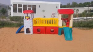 INDOOR OUTDOOR PLASTIC PLAYHOUSE WITH A SLIDE FOR KIDS ACTIVITY. SIZE; 400X170X175CM