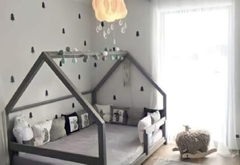 kid's bed-like house with columns and a fence