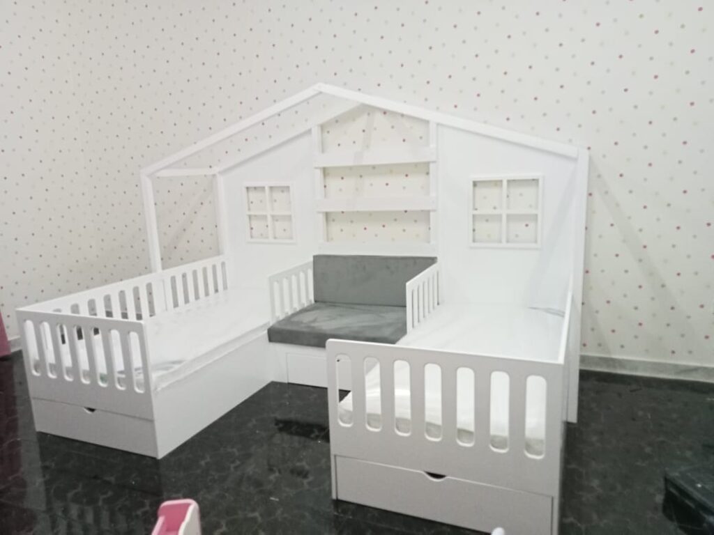 Two beds with a sofa