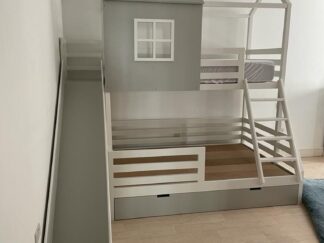 Bunk bed has two different sizes, like the house shape.