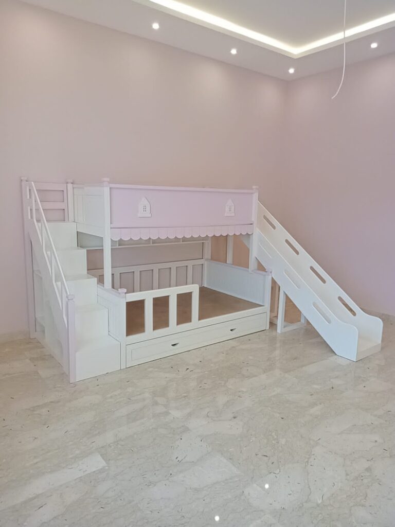 Bunk bed with a slide, stair, and CNC house shapes