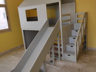 House-shaped bunk bed with a large slide
