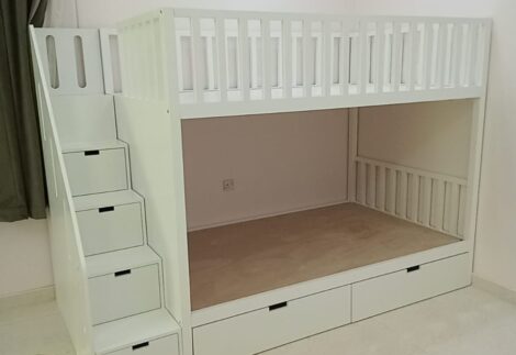 Bunk bed with railings at the top