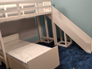 Two bunk beds in two different directions and a slide