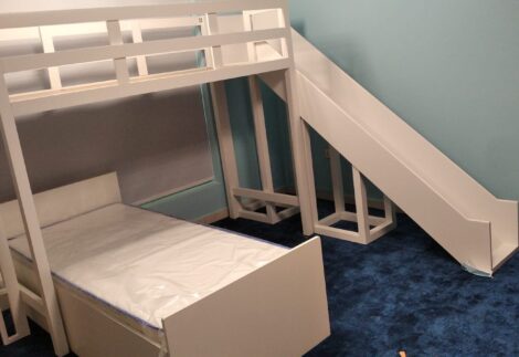 Two bunk beds in two different directions and a slide