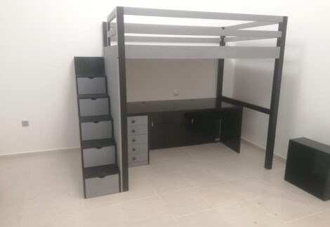 Loft bed with lower desk and side stair