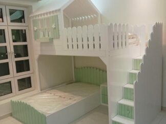 A bunk bed with a hut at the top and a fence that resembles a garden fence