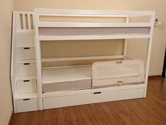 Bunk bed with storage drawers under the stairs and a lower drawer under the bed