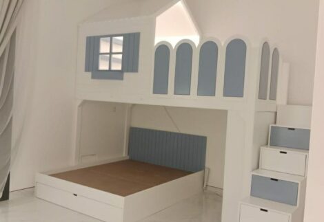 Bunk bed has a small upper hut, lower bed, lower side shelves, stair and slide