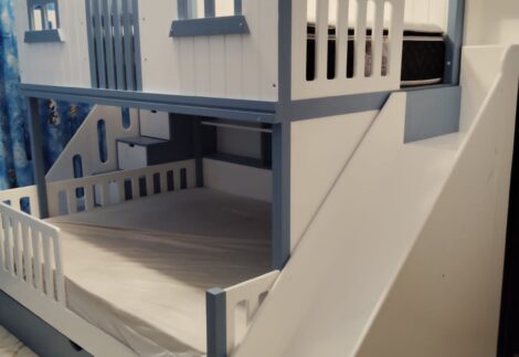 House bed with wall shelves