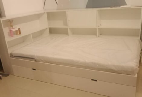 Bed with side shelves and bottom storage drawer