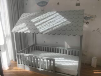 A bed with a cover similar to that of a home