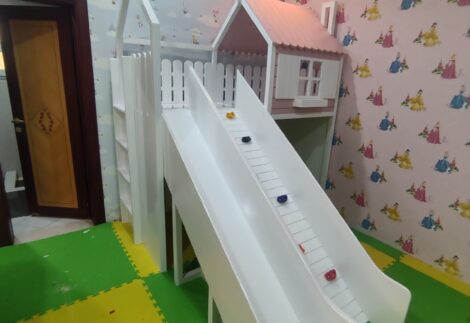Loft bed with hut, climbing board and slide
