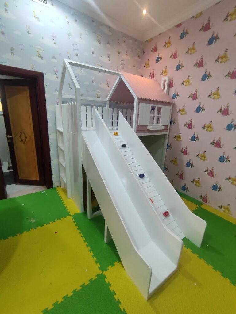 Loft bed with hut, climbing board and slide